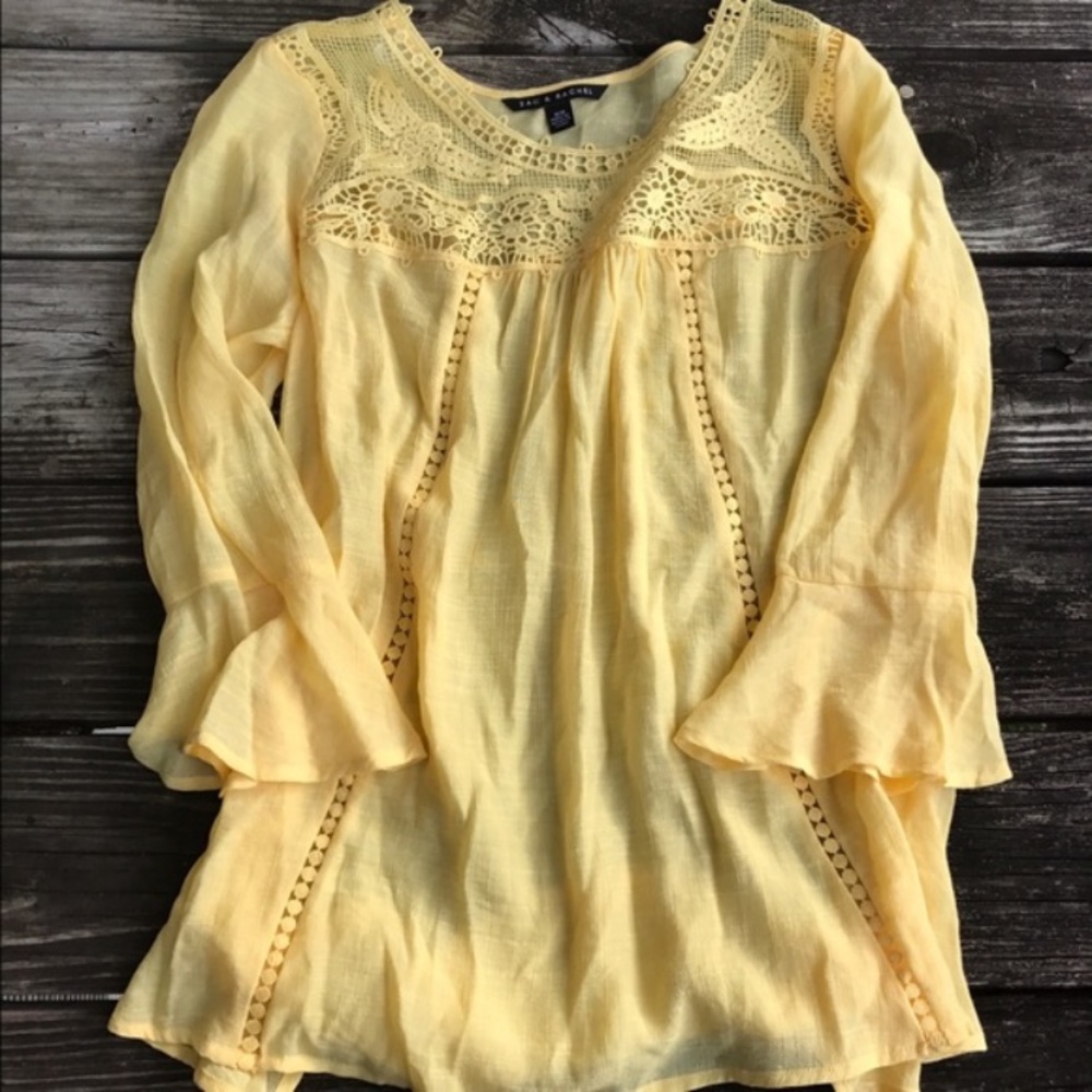 Sheer yellow bell sleeve top.
